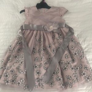 Beautiful, party dress with embroidered details.